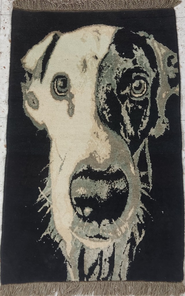 Hand-knotted dog portrait rug in wool, woven at Woolway Studios Yerevan using natural tones of cream, black, and grey. Custom pet textile art.